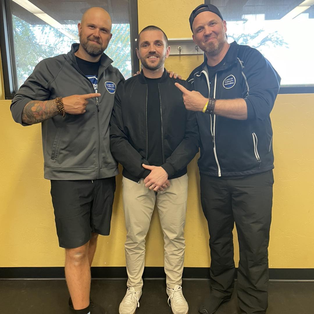 Freddy posing with Dr. Sean and Jeff after certification